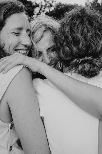 close-up of women hugging