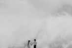 newly weds in surrounded by clouds