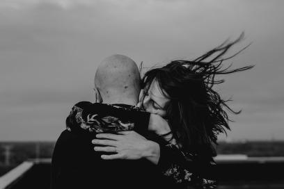 boy and girl hugging wind in hair