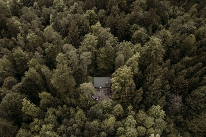 drone shot of cabin in the woods