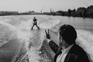 men waterskiing in their suits
