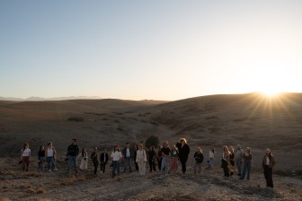 group shot of photographers standing in the desert